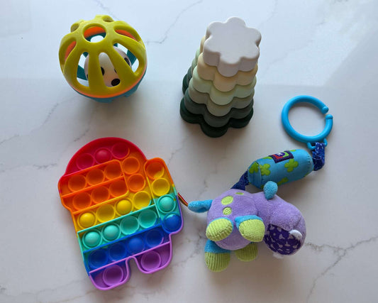 Baby toy bundle; carseat rattle, popit, stacker toy, ball