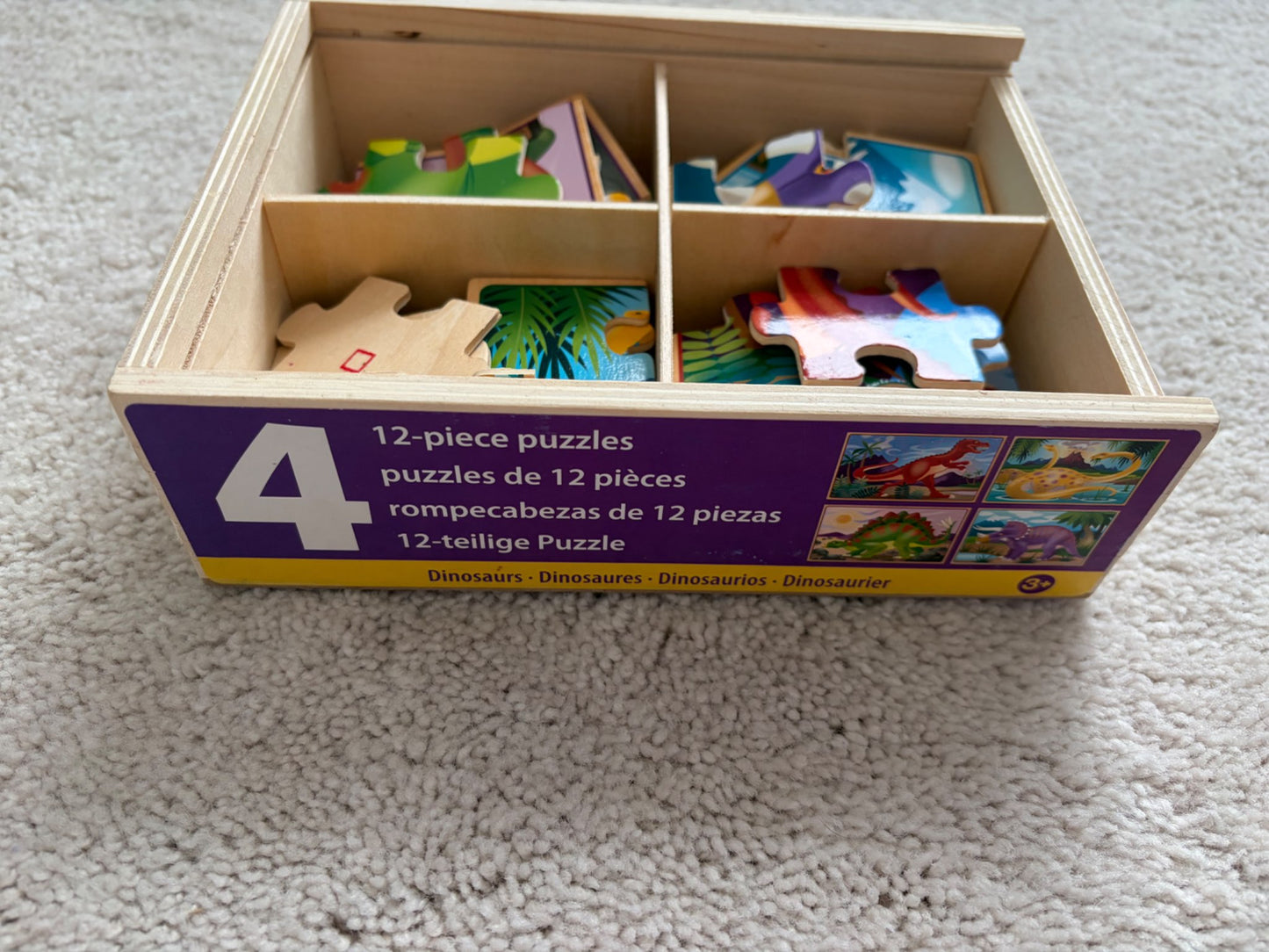 Melissa + Doug 4-in-1 Wooden Dino Puzzles *writing on box*