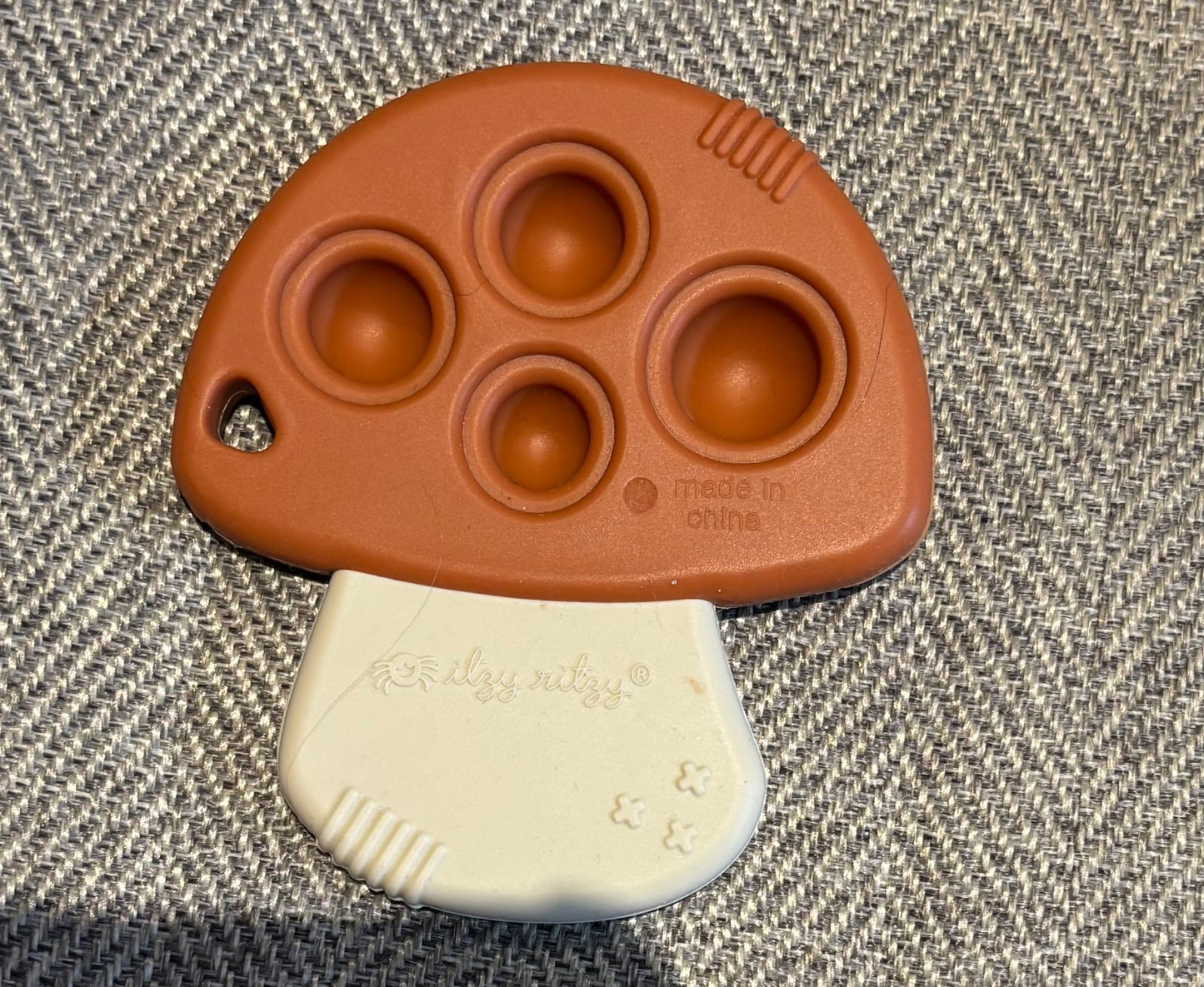 Itzy ritzy mushroom teether and fidget toy