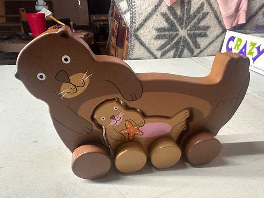 Big and little roly poly otter push toy