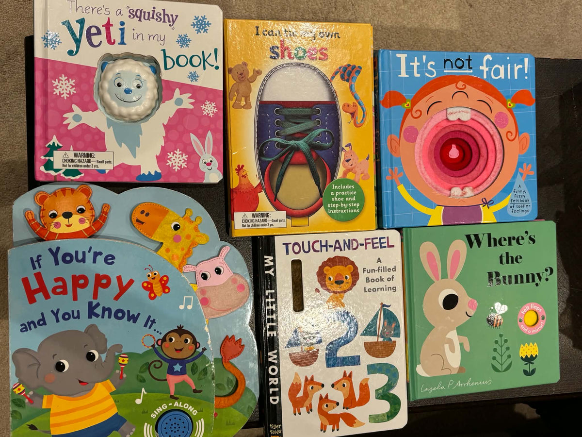 Interactive board books (flaps, textures, "puppets")