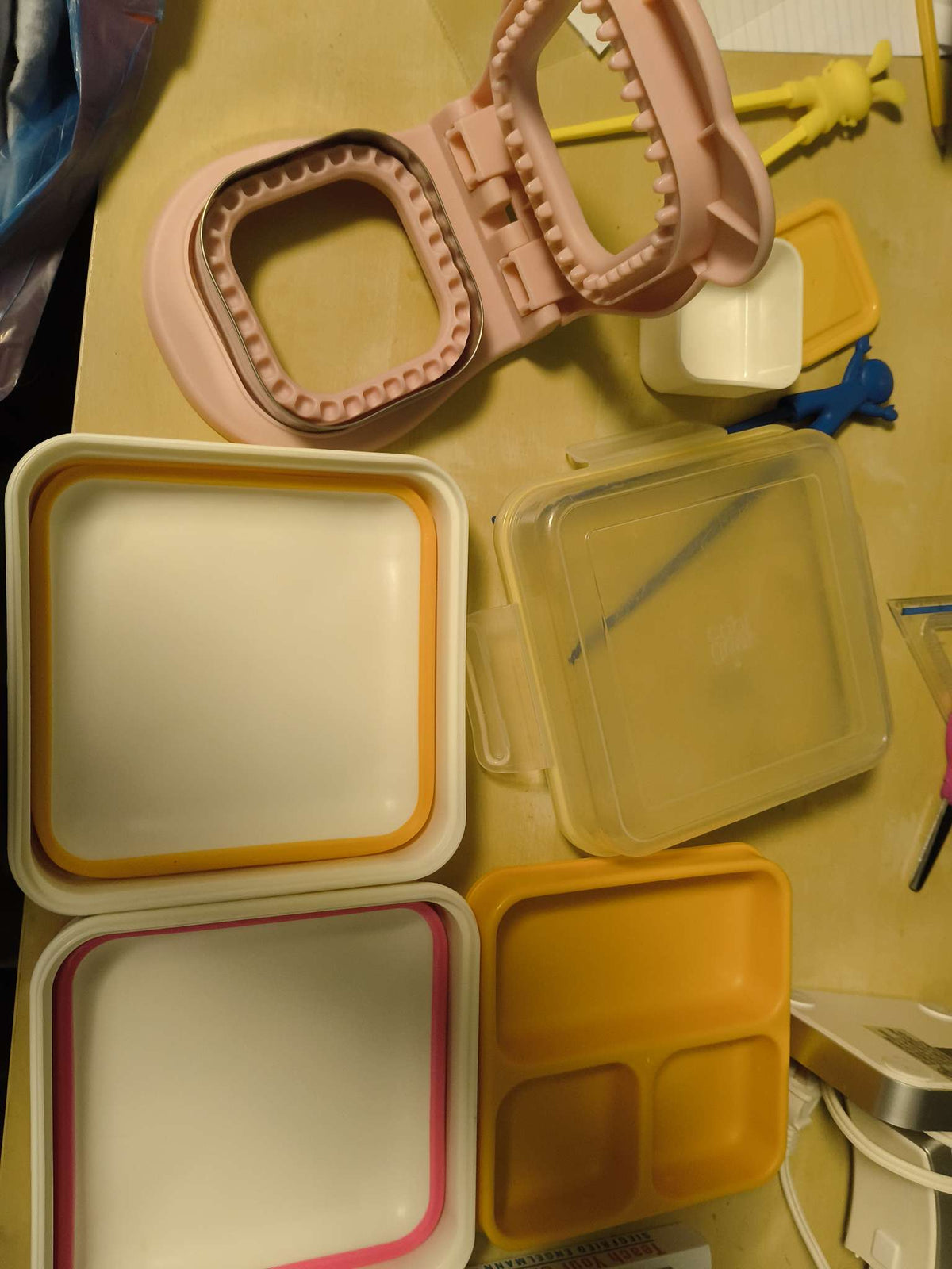 Lunch containers, chopsticks and bread cutter