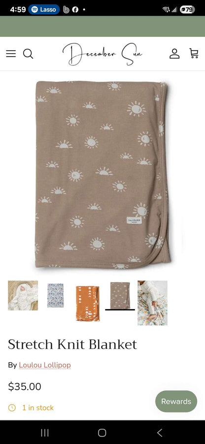 Lululollipop stretch brown rainbow blanket retails $35