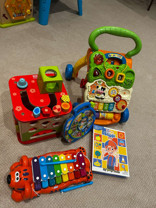 Toy bundle: Hape wooden activity cube (MSRP $75), xylophone/piano, Vtech sit-to-stand learning walker, Fisher Price animal sounds, Blippy book with figurines