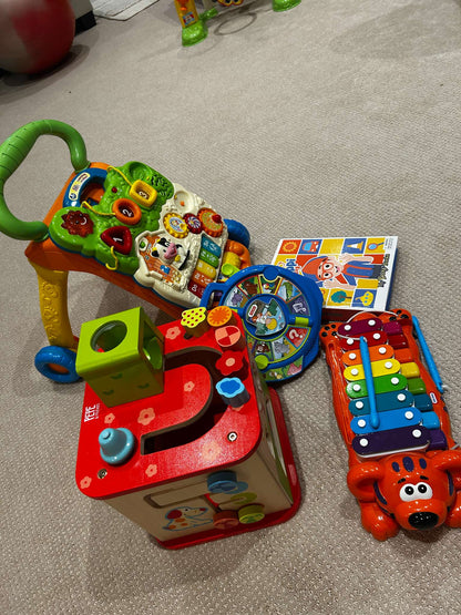 Toy bundle: Hape wooden activity cube (MSRP $75), xylophone/piano, Vtech sit-to-stand learning walker, Fisher Price animal sounds, Blippy book with figurines