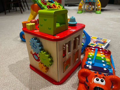 Toy bundle: Hape wooden activity cube (MSRP $75), xylophone/piano, Vtech sit-to-stand learning walker, Fisher Price animal sounds, Blippy book with figurines