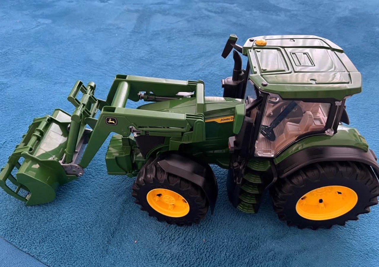 Bruder tractor with removeable attachment