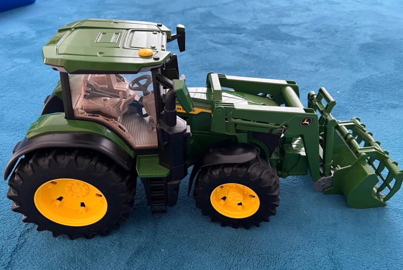 Bruder tractor with removeable attachment