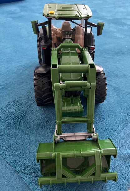 Bruder tractor with removeable attachment