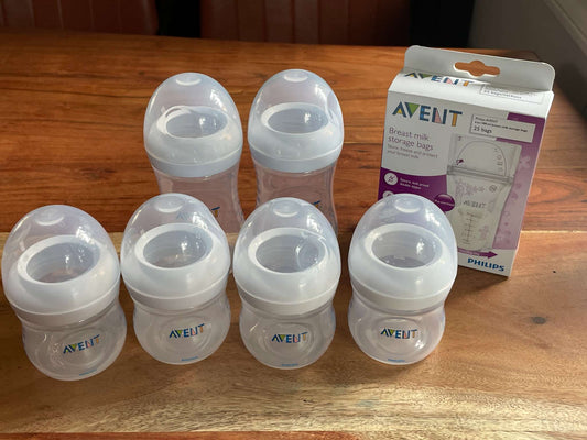 Set of 6 AVENT bottles and a NEW Unopened Box of Breast Milk Storage Bags