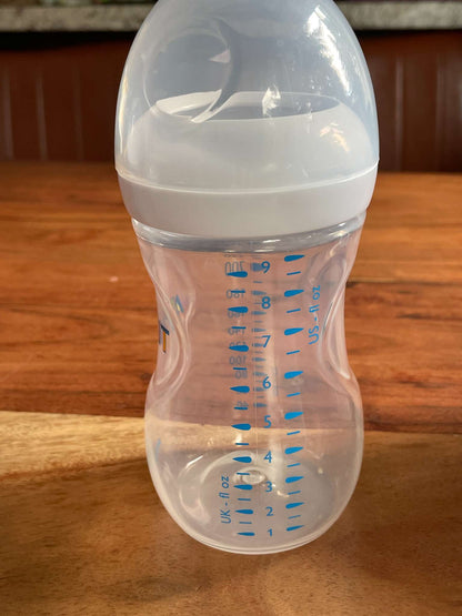 Set of 6 AVENT bottles and a NEW Unopened Box of Breast Milk Storage Bags