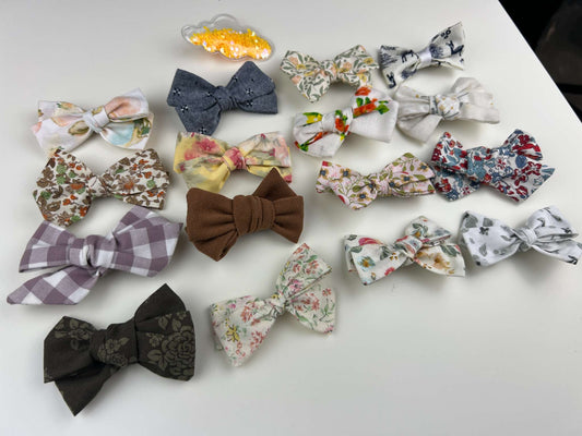 Sixteen (16) Bow hair clips + one fun cloud hair clip, on alligator clips