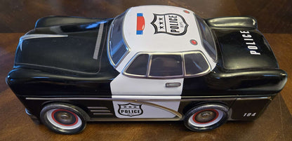 Car-shaped tin full of toy cars!