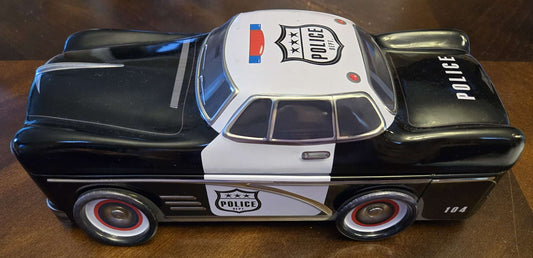 Car-shaped tin full of toy cars!
