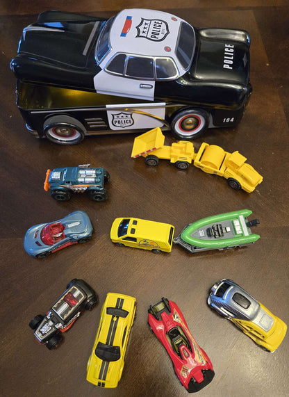 Car-shaped tin full of toy cars!
