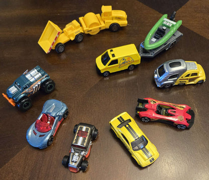 Car-shaped tin full of toy cars!