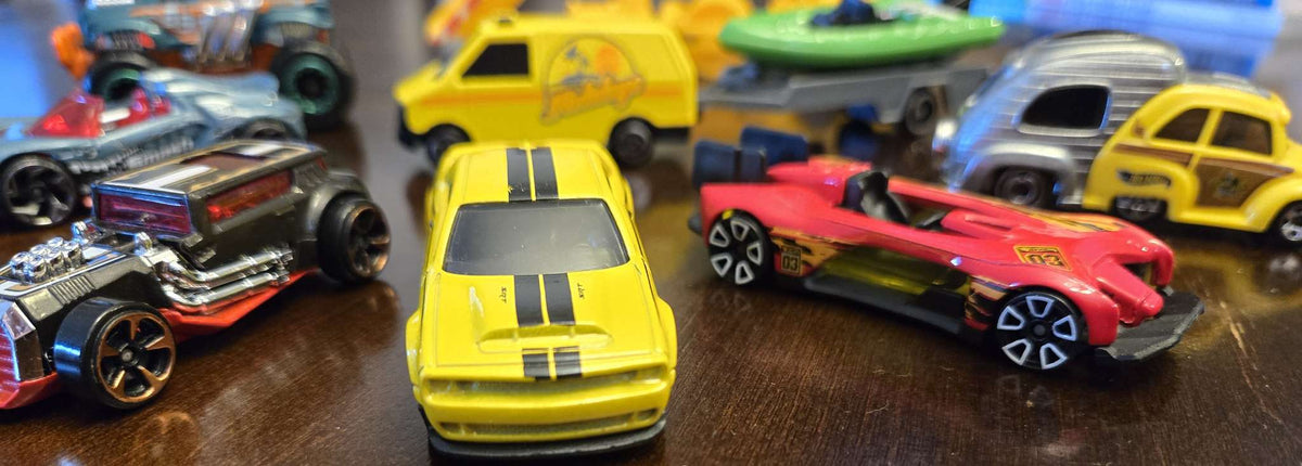 Car-shaped tin full of toy cars!