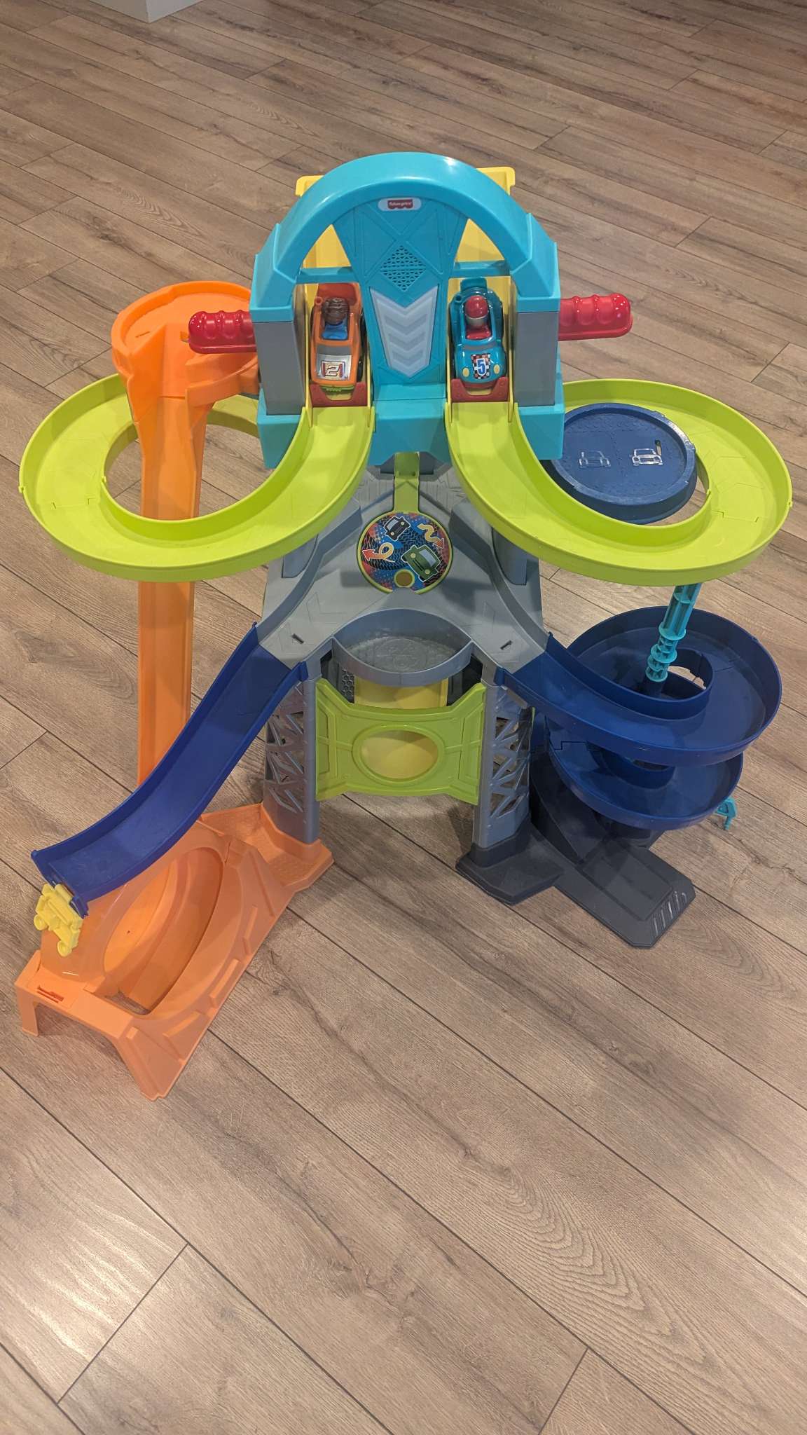 Fisher price race track with 2 cars