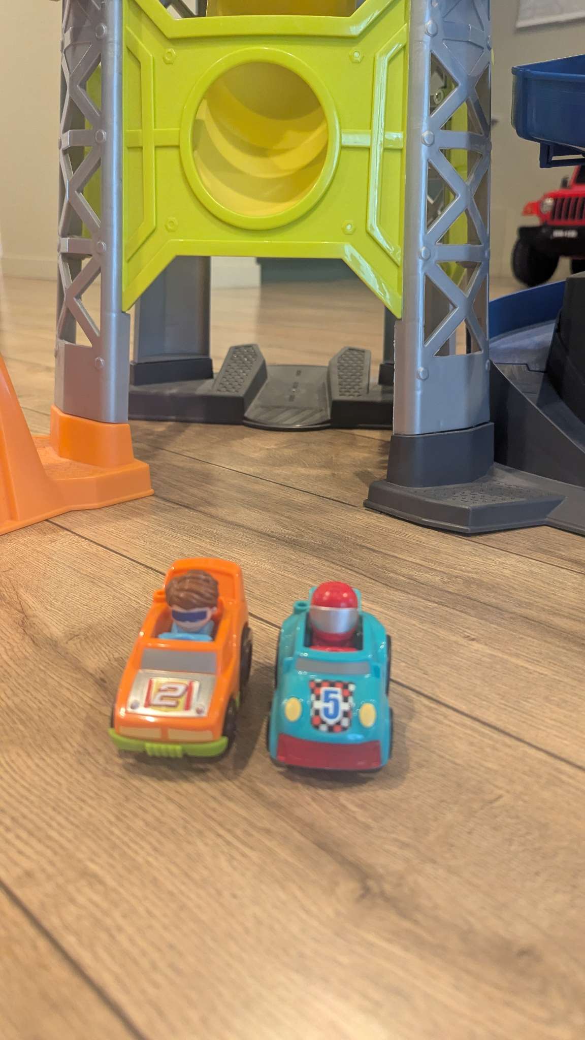 Fisher price race track with 2 cars
