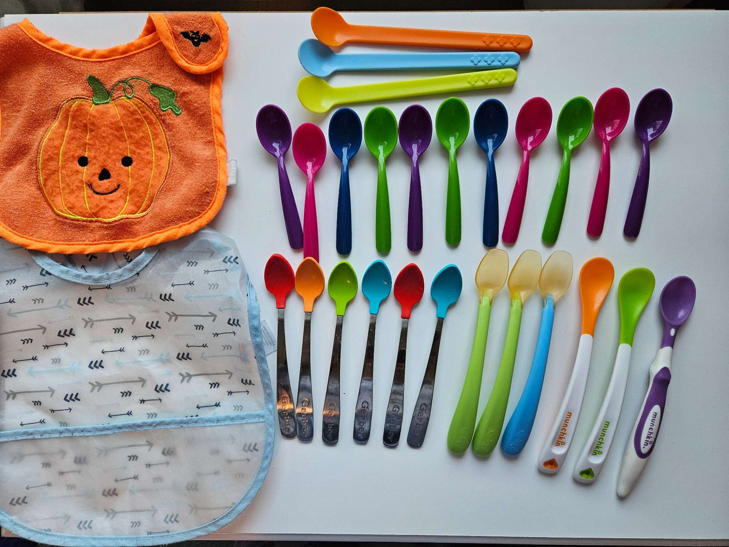 26 baby feeding spoons and 2 bibs (wipeable and pumpkin)