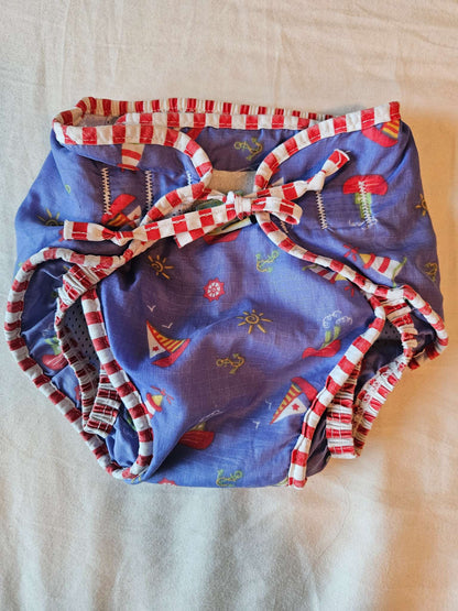 Size medium Kushies reusable swim diaper (purple boats) MSRP $16.99, Kids 12 Month (9-12M)