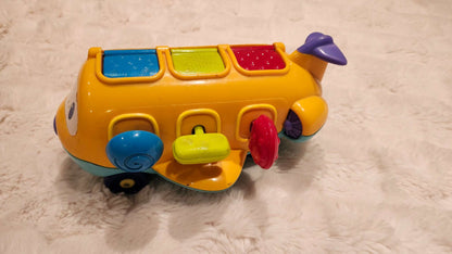 Bright Starts Pop-Up Airplane Music Toy