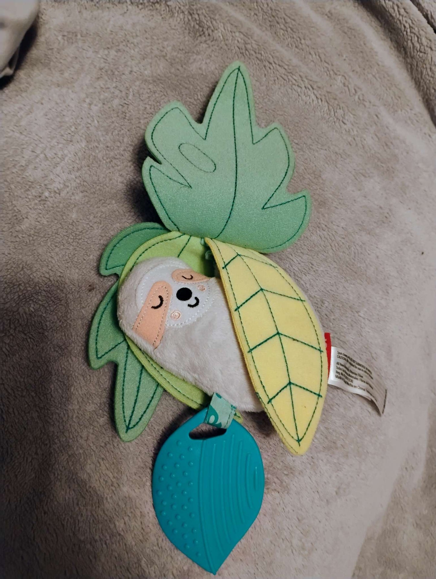 Skip Hop Tropical paradise sloth jitter toy with Plastic teether