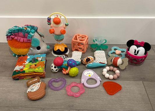 Baby toy bundle including munch mitt