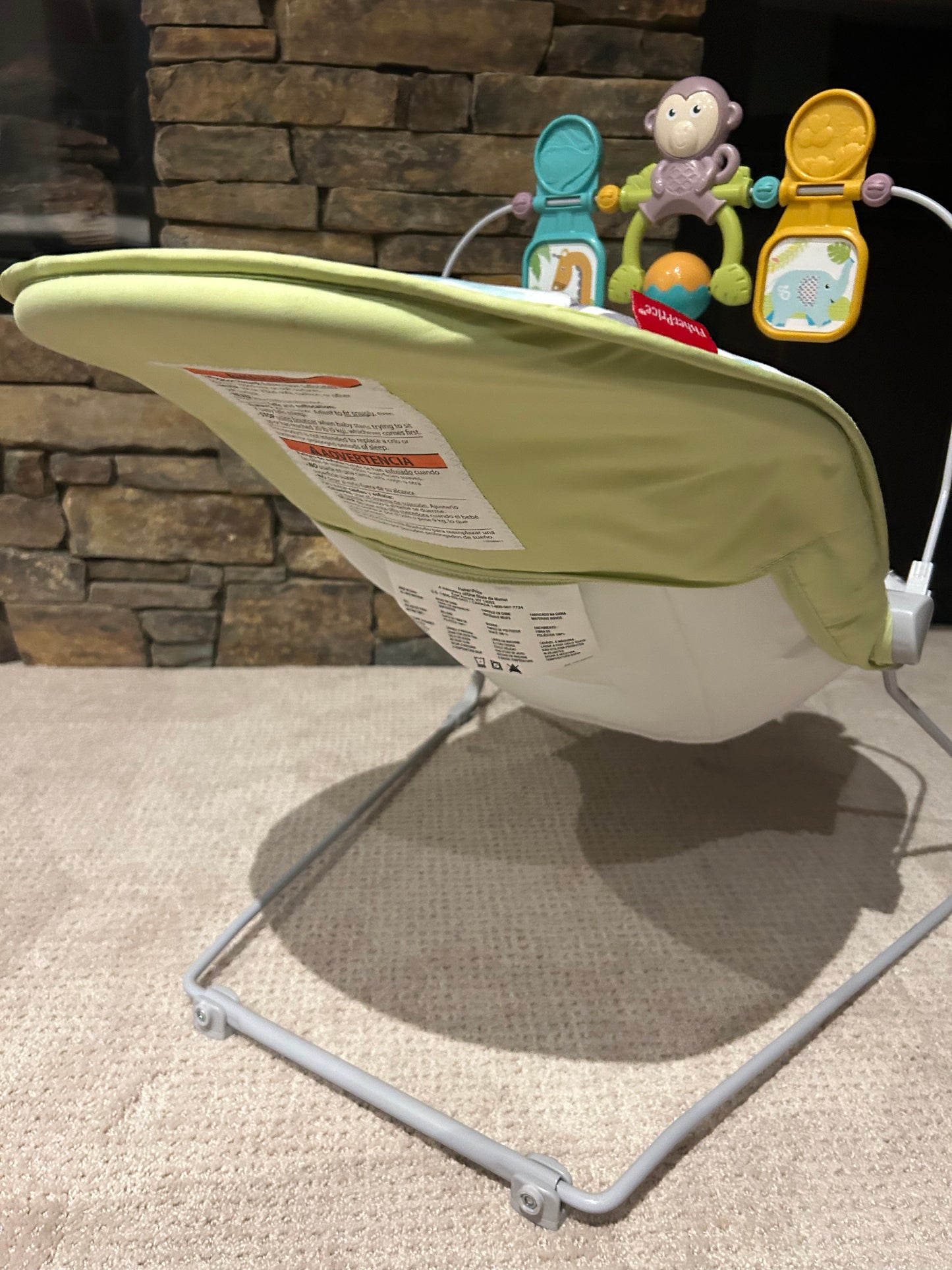 Fisher Price baby bouncer with toys and vibrating seat
